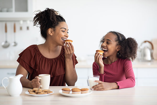 Mother and daughter eating