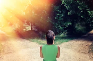 Woman facing two path choices.