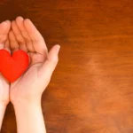 Hands holding a heart