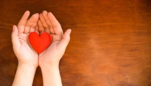Hands holding a heart