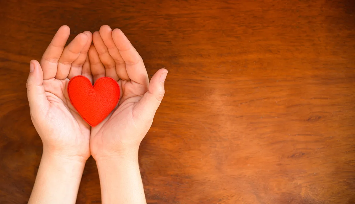 Hands holding a heart